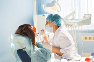 young-woman-getting-dental-treatment-PG7VGP8